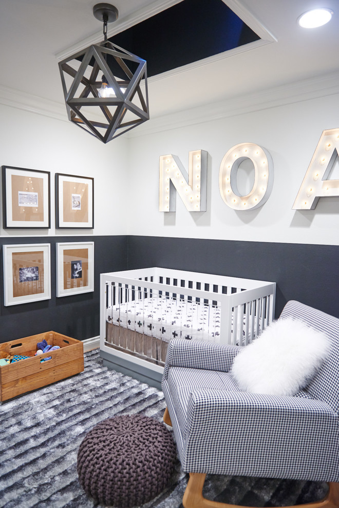 This is an example of a small contemporary gender-neutral nursery in Orange County with grey walls and grey floor.
