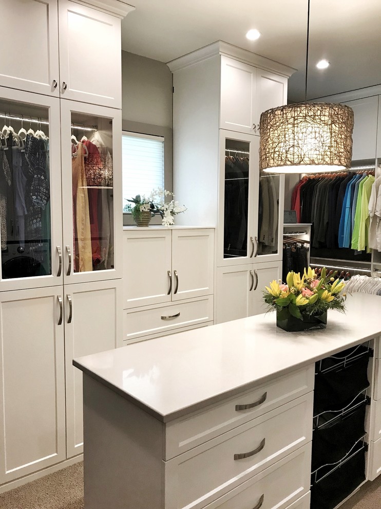 Photo of a large transitional walk-in wardrobe in Other with flat-panel cabinets, white cabinets, carpet and beige floor.