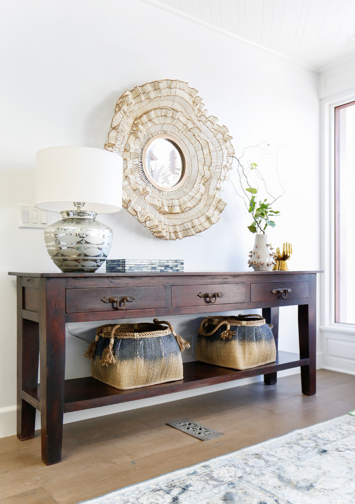 Mid-sized beach style dark wood floor foyer photo in Orange County with white walls and a dark wood front door