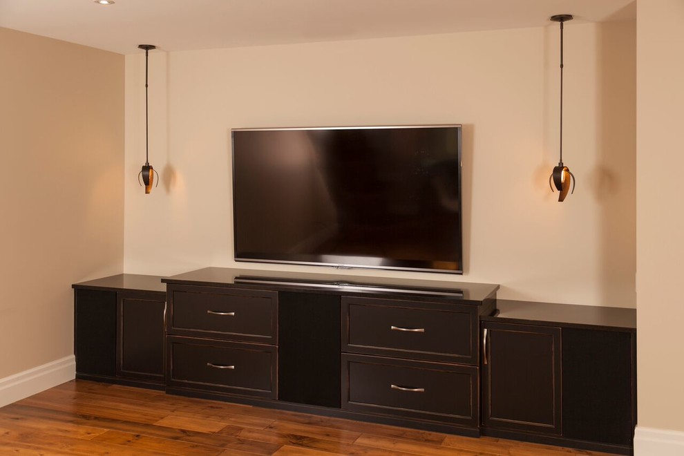 Inspiration for a mid-sized transitional l-shaped medium tone wood floor open concept kitchen remodel in Toronto with a double-bowl sink, recessed-panel cabinets, dark wood cabinets, solid surface countertops, gray backsplash, stone tile backsplash, stainless steel appliances and no island
