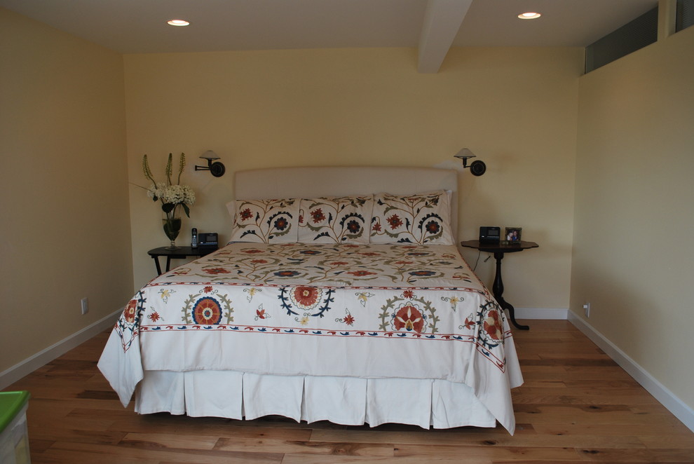 Where should beside wall sconces be placed