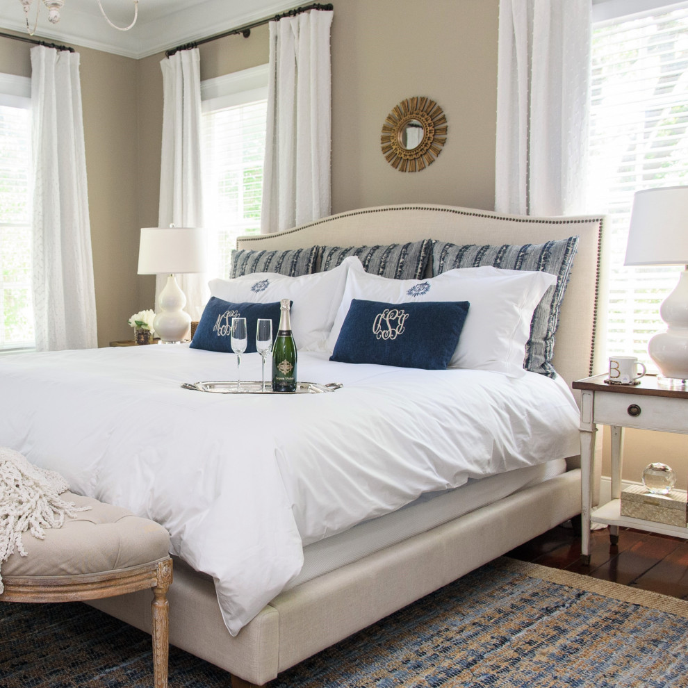 Inspiration for a mid-sized transitional master bedroom in Charleston with beige walls, medium hardwood floors, a standard fireplace, a brick fireplace surround, brown floor and vaulted.