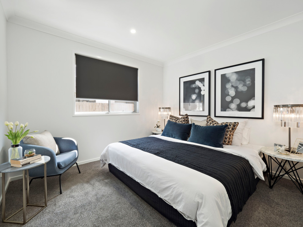 This is an example of a mid-sized contemporary master bedroom in Brisbane with grey walls, carpet and grey floor.