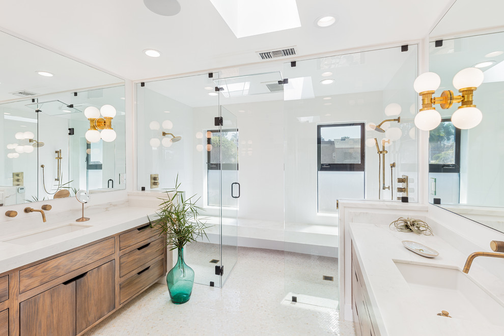 Photo of a contemporary master bathroom in San Diego with flat-panel cabinets, dark wood cabinets, a double shower, white walls, an undermount sink, white floor and a hinged shower door.