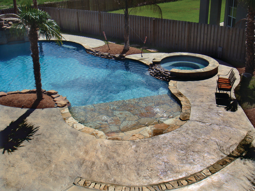 Example of a beach style pool design in New Orleans