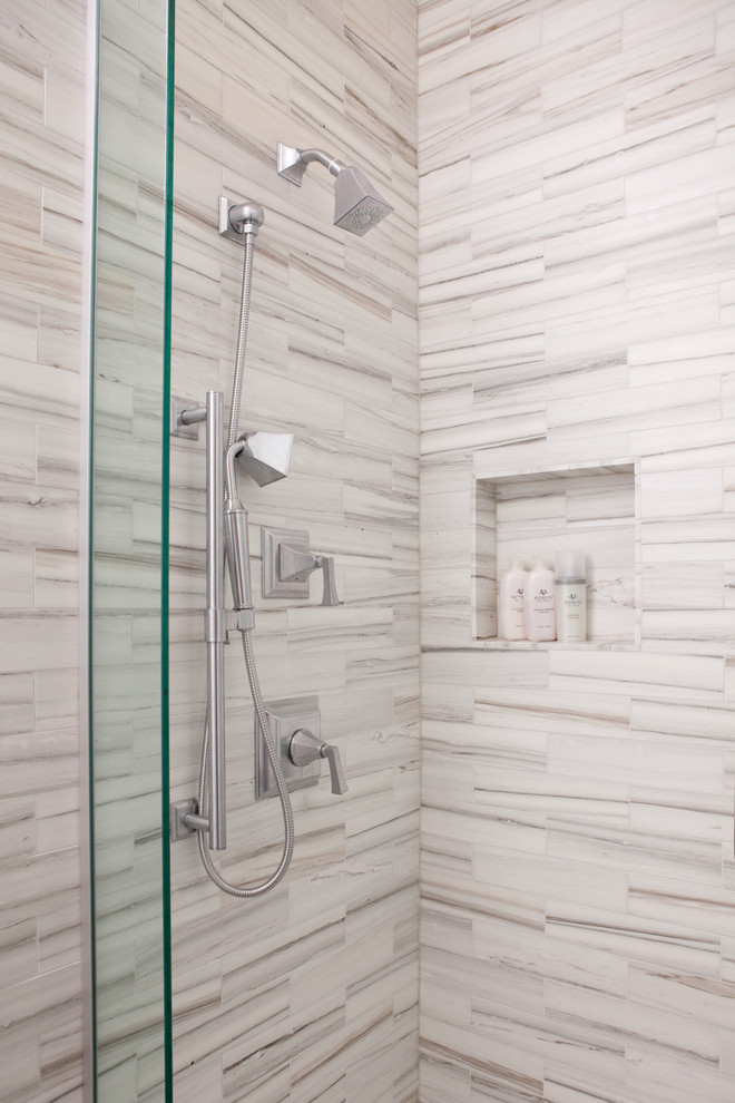 Design ideas for a large modern master bathroom in Chicago with shaker cabinets, dark wood cabinets, a corner shower, a one-piece toilet, multi-coloured tile, glass sheet wall, grey walls, porcelain floors, a drop-in sink, solid surface benchtops, beige floor and a hinged shower door.