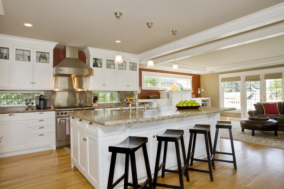 Design ideas for a traditional open plan kitchen in Seattle with shaker cabinets, white cabinets, metallic splashback, metal splashback and stainless steel appliances.