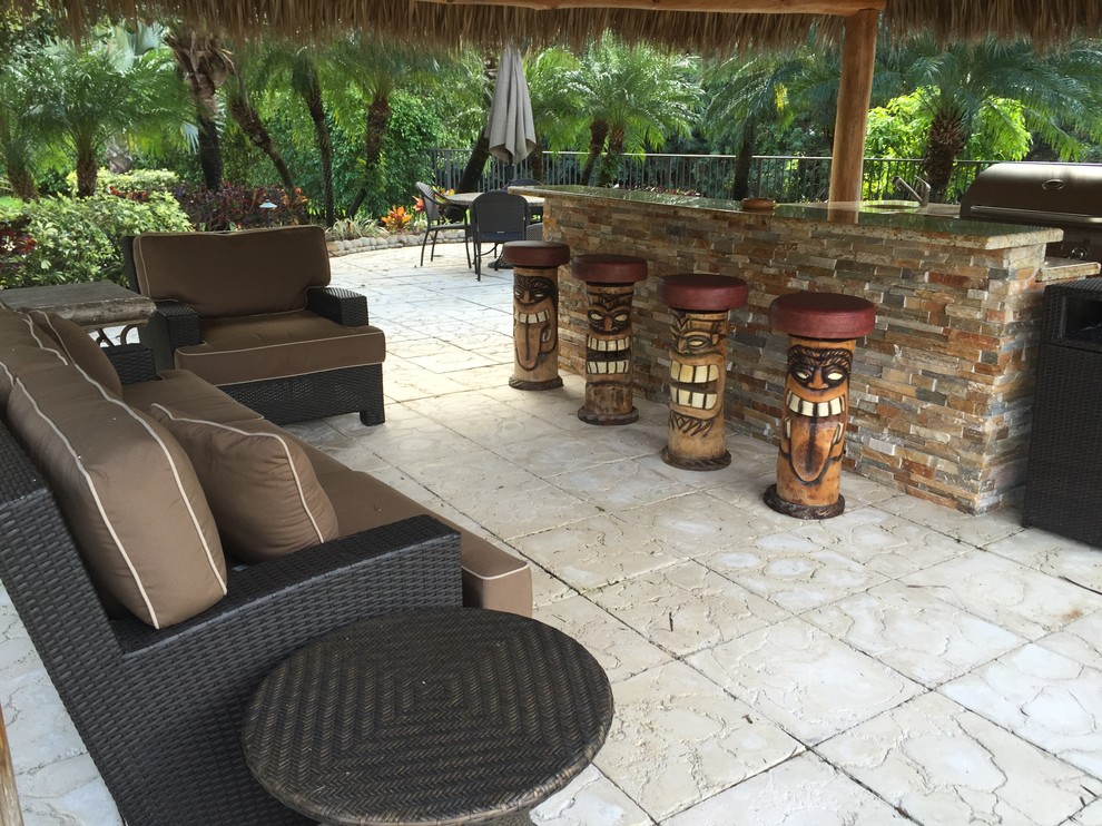 Island style patio photo in Miami