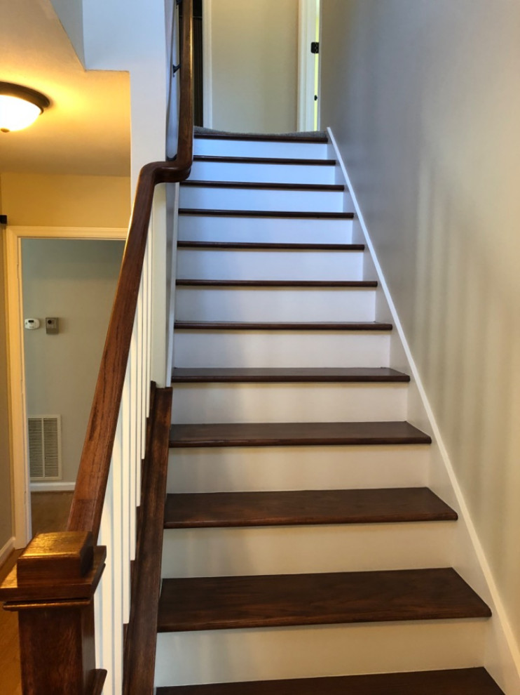 Inspiration for a wooden straight wood railing staircase remodel with painted risers