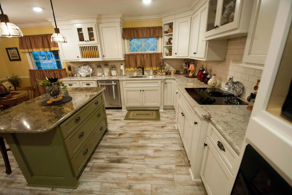 Example of a mid-sized arts and crafts l-shaped vinyl floor and beige floor eat-in kitchen design with a double-bowl sink, shaker cabinets, white cabinets, granite countertops, white backsplash, stainless steel appliances, an island and subway tile backsplash
