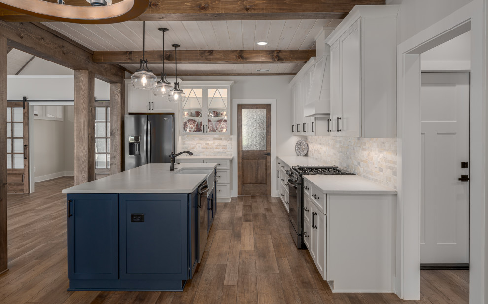 Eat-in kitchen - mid-sized country l-shaped vinyl floor, brown floor and coffered ceiling eat-in kitchen idea in Atlanta with a farmhouse sink, shaker cabinets, beige cabinets, quartz countertops, beige backsplash, marble backsplash, stainless steel appliances, an island and beige countertops