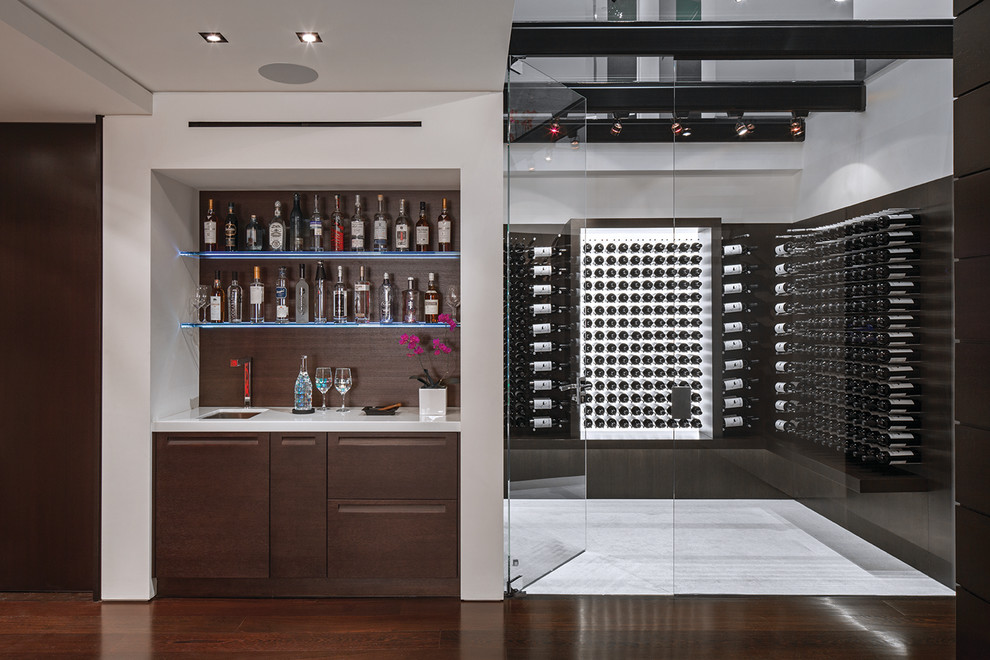 Expansive modern wine cellar in Los Angeles with storage racks and white floor.