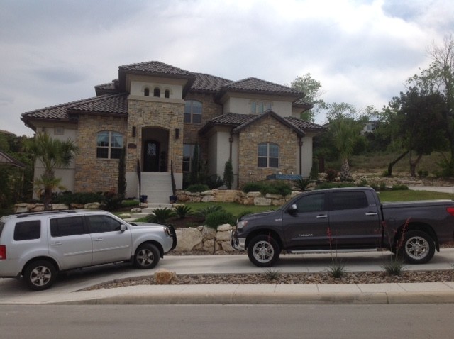 Mid-sized transitional home design photo in Austin