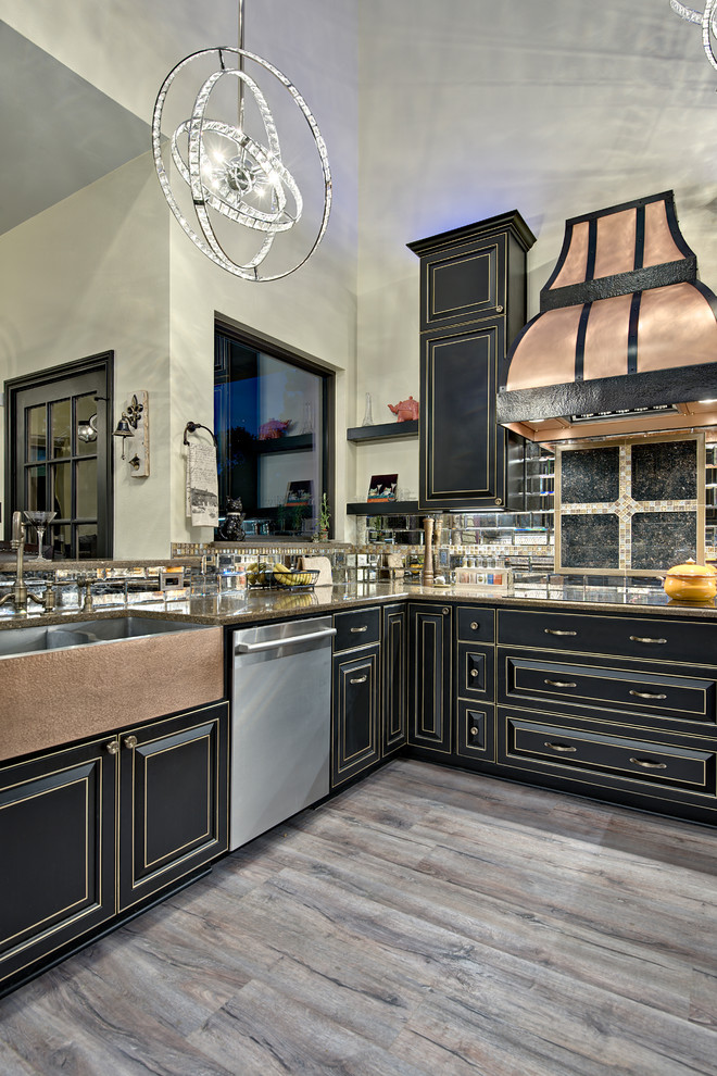This is an example of a mid-sized modern u-shaped eat-in kitchen in Austin with a farmhouse sink, raised-panel cabinets, black cabinets, quartz benchtops, black splashback, mirror splashback, stainless steel appliances, vinyl floors, a peninsula, brown floor and multi-coloured benchtop.