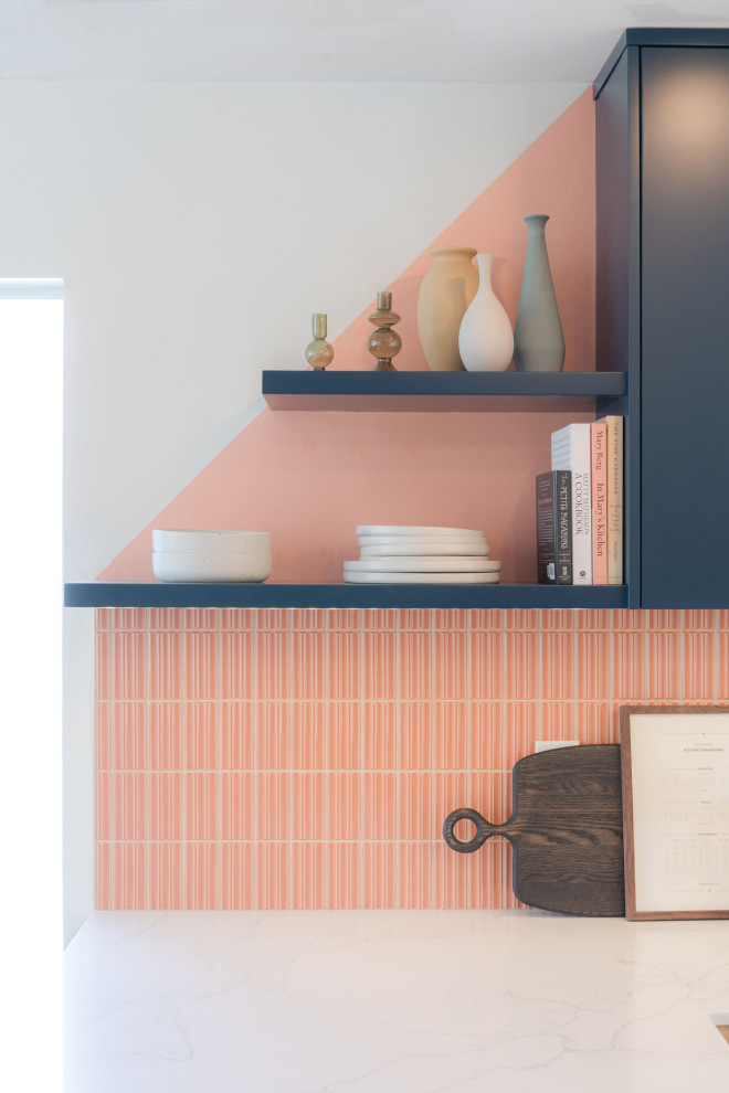 Inspiration for a small transitional u-shaped terrazzo floor and white floor eat-in kitchen remodel in Vancouver with a farmhouse sink, flat-panel cabinets, light wood cabinets, quartz countertops, pink backsplash, porcelain backsplash, stainless steel appliances, an island and white countertops