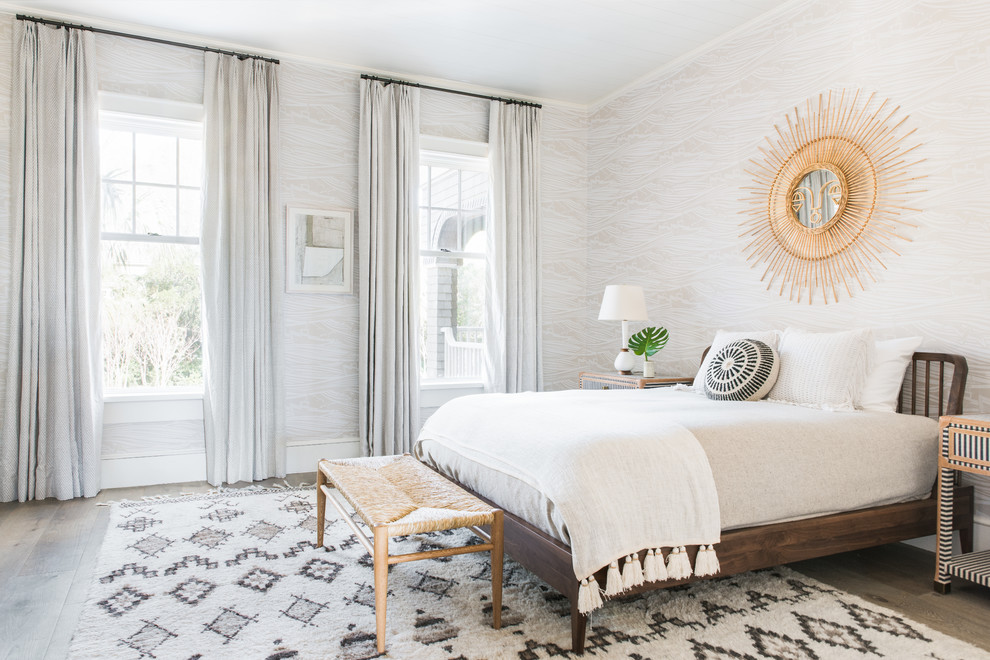 Inspiration for a beach style master bedroom in Charleston with no fireplace and dark hardwood floors.