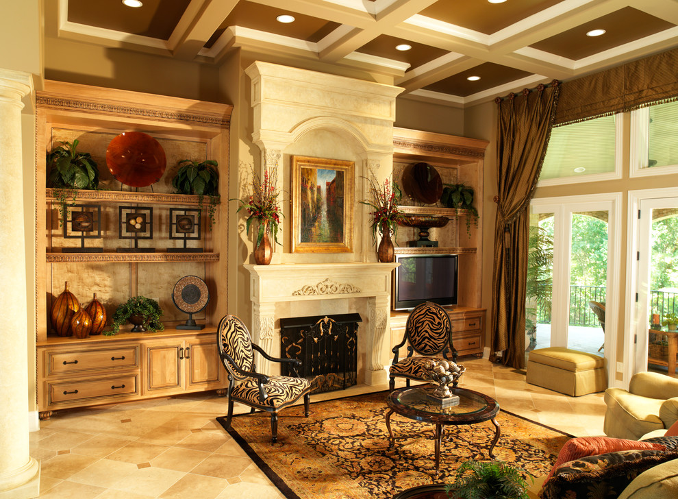 Photo of a mid-sized traditional formal enclosed living room in Nashville with beige walls, limestone floors, a standard fireplace, a stone fireplace surround, a freestanding tv and beige floor.