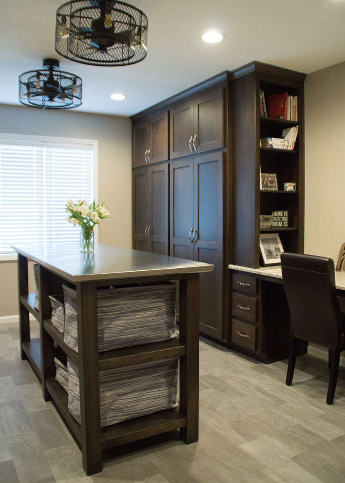 Inspiration for a transitional gray floor utility room remodel with an utility sink, recessed-panel cabinets, granite countertops, gray walls and a side-by-side washer/dryer