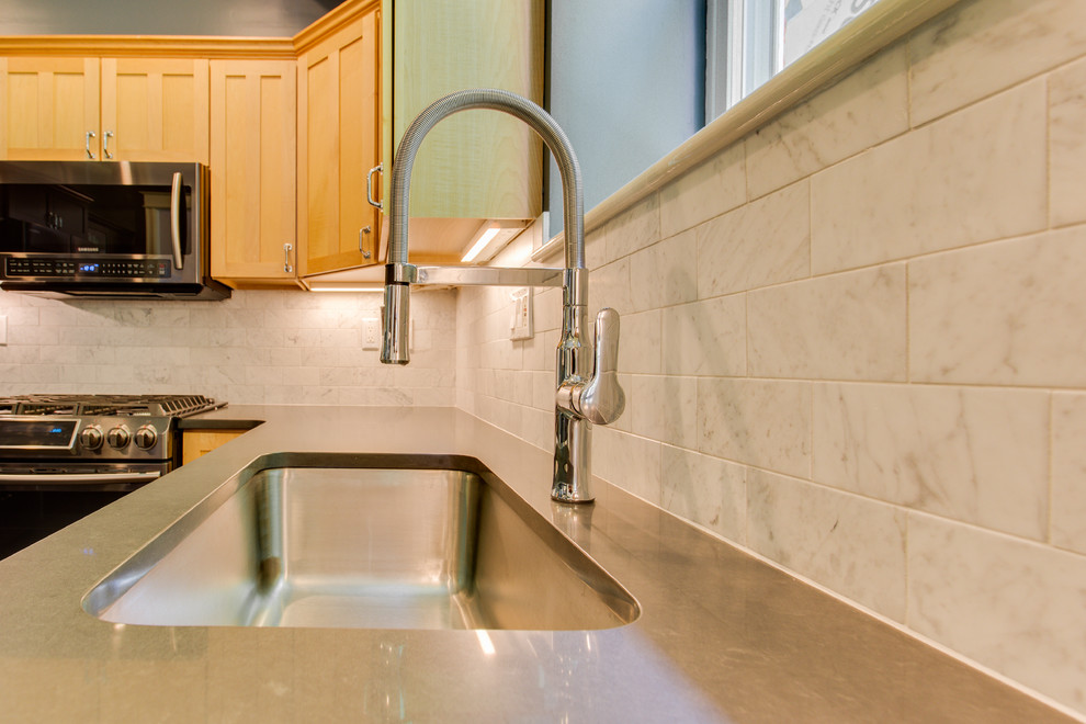 Kitchen - mid-sized transitional kitchen idea in DC Metro with recessed-panel cabinets, quartz countertops, stainless steel appliances and a peninsula