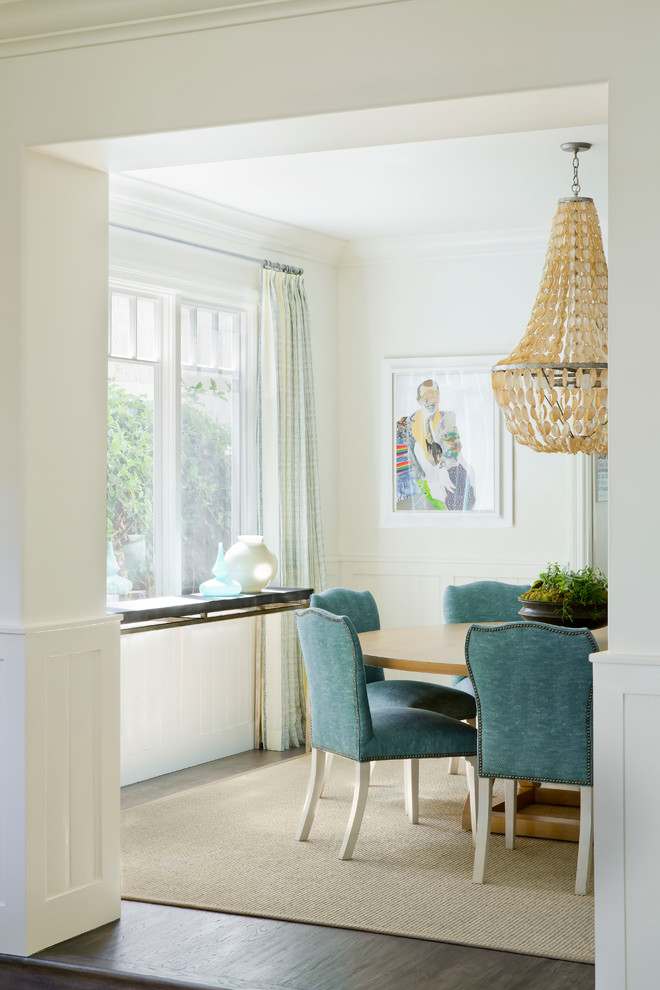 Mid-sized beach style dining room in Los Angeles with white walls and dark hardwood floors.
