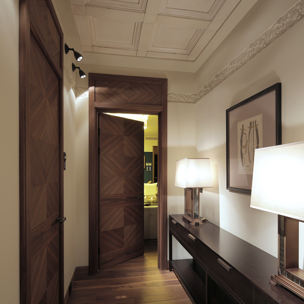 Design ideas for a contemporary hallway in Moscow with white walls and dark hardwood floors.
