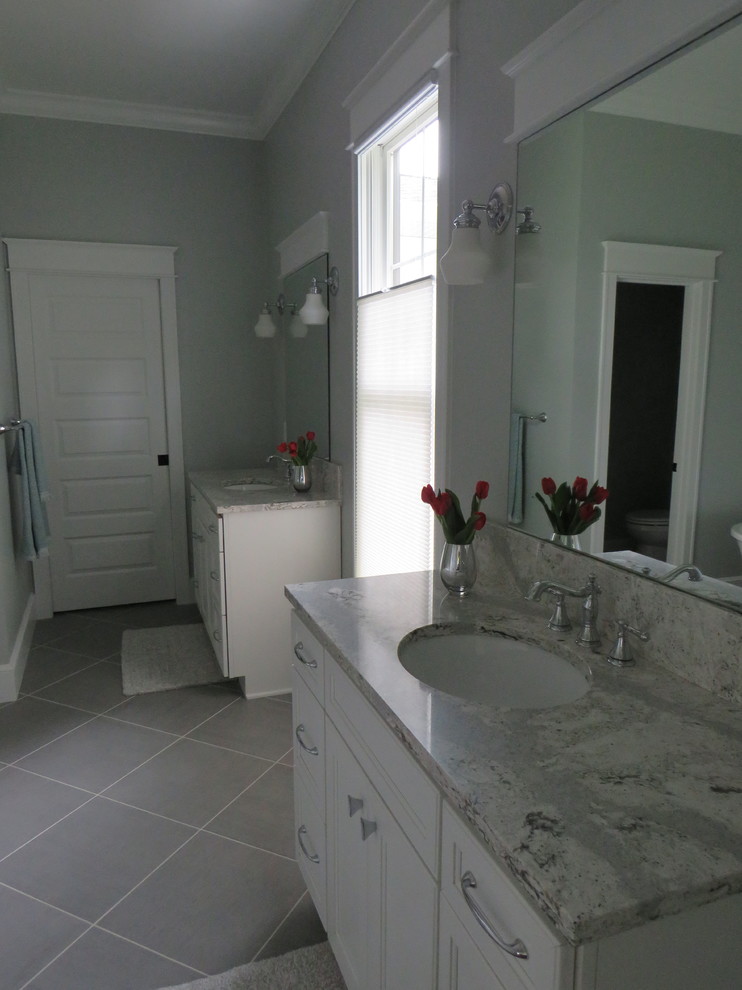 Design ideas for a large country master bathroom in Grand Rapids with shaker cabinets, white cabinets, a freestanding tub, a one-piece toilet, green walls, ceramic floors, an undermount sink and marble benchtops.