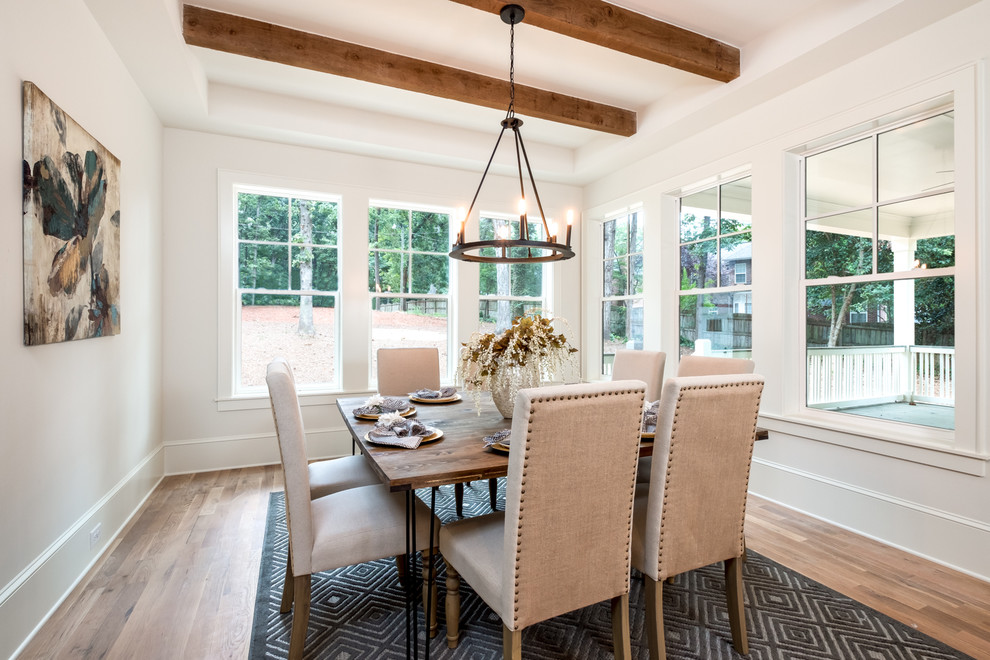 Example of a classic dining room design in Charlotte