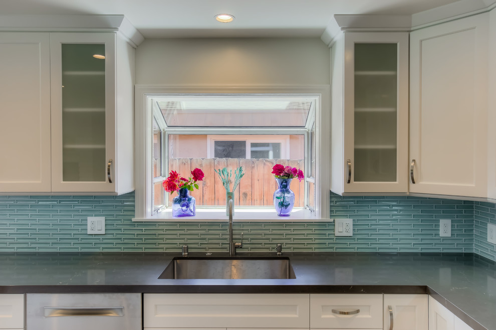 Inspiration for a small transitional porcelain tile and gray floor eat-in kitchen remodel in Los Angeles with an undermount sink, shaker cabinets, white cabinets, quartz countertops, stainless steel appliances and an island