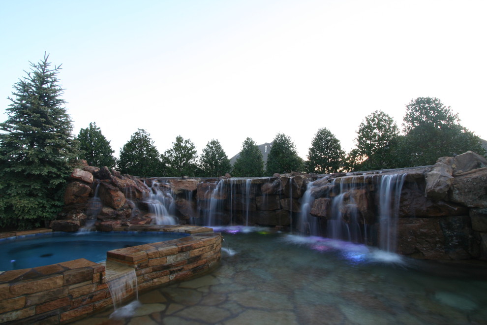 Design ideas for a small country backyard custom-shaped natural pool in Oklahoma City with a hot tub.