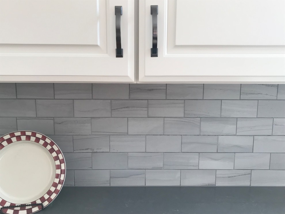 Inspiration for a transitional home design remodel in Cincinnati with gray backsplash and porcelain backsplash