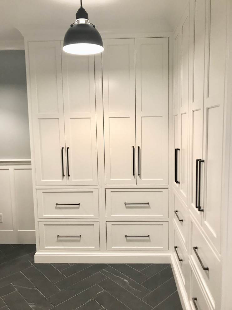 Inspiration for a small transitional mudroom in Boston with blue walls, ceramic floors, a single front door, a white front door and black floor.