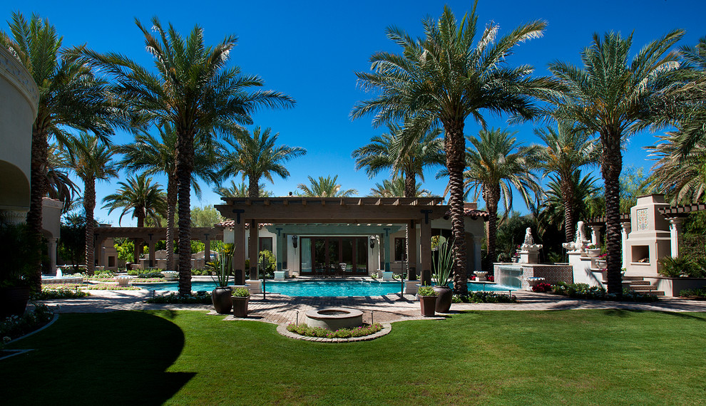 Pool fountain - huge transitional backyard brick and rectangular natural pool fountain idea in Phoenix