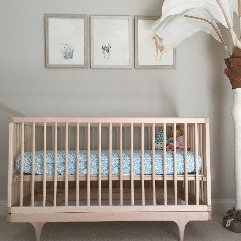 Photo of an eclectic nursery for girls in Wilmington with beige walls and carpet.