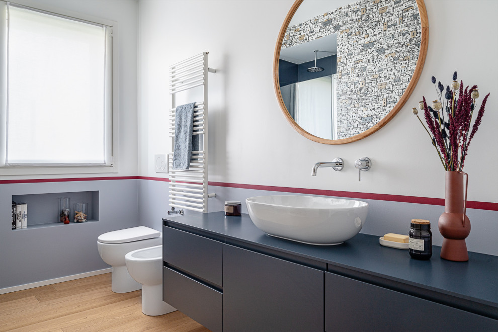 Design ideas for a small contemporary 3/4 bathroom in Other with flat-panel cabinets, blue cabinets, an alcove shower, white walls, light hardwood floors, a vessel sink, wood benchtops, a hinged shower door, blue benchtops, a single vanity and a floating vanity.