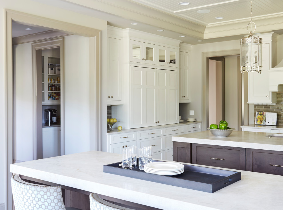Transitional kitchen photo in Chicago with two islands