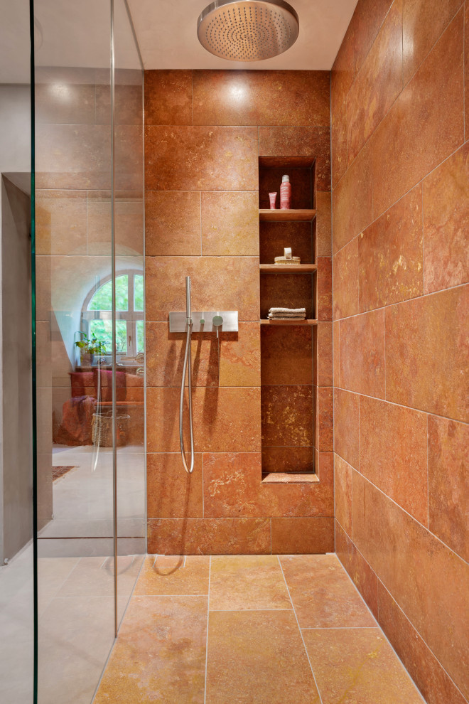 Large tropical bathroom in Munich with dark wood cabinets, a corner tub, a curbless shower, beige tile, travertine, beige walls, concrete floors, a vessel sink, concrete benchtops, beige floor, an open shower, brown benchtops, a single vanity, a freestanding vanity and vaulted.
