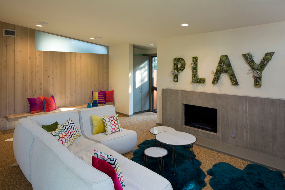 This is an example of a midcentury gender-neutral kids' playroom in Austin with beige walls.