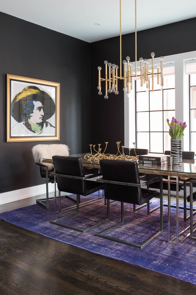 Photo of a contemporary dining room in Toronto with black walls and dark hardwood floors.