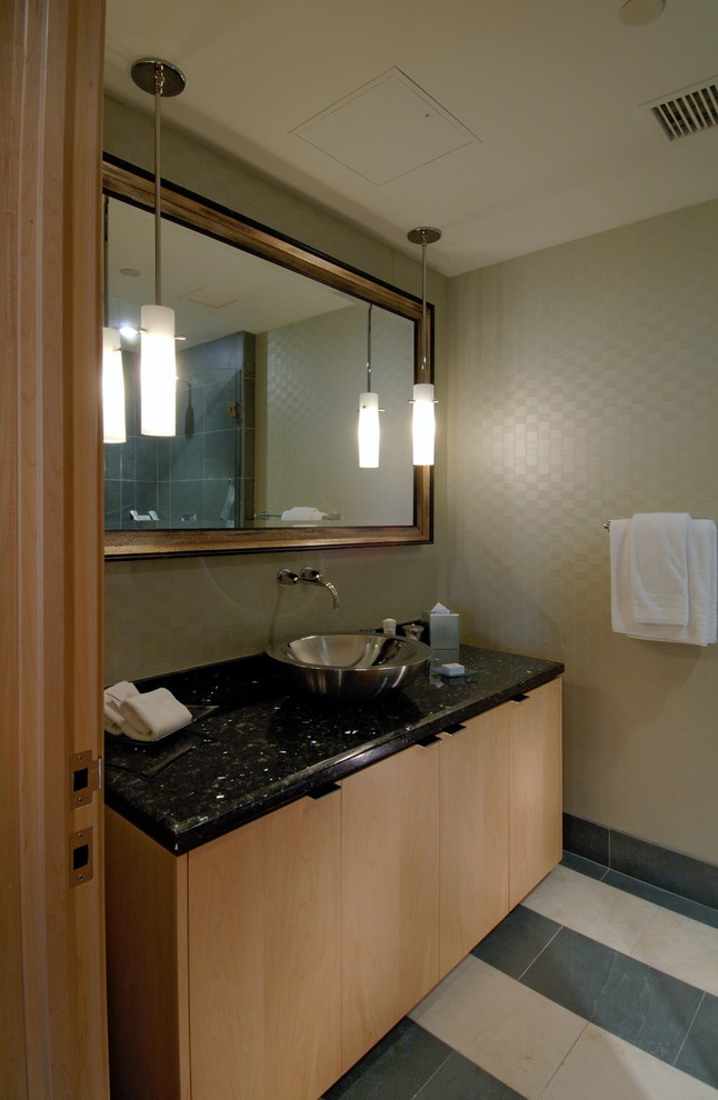 This is an example of a contemporary powder room in Vancouver with a vessel sink.
