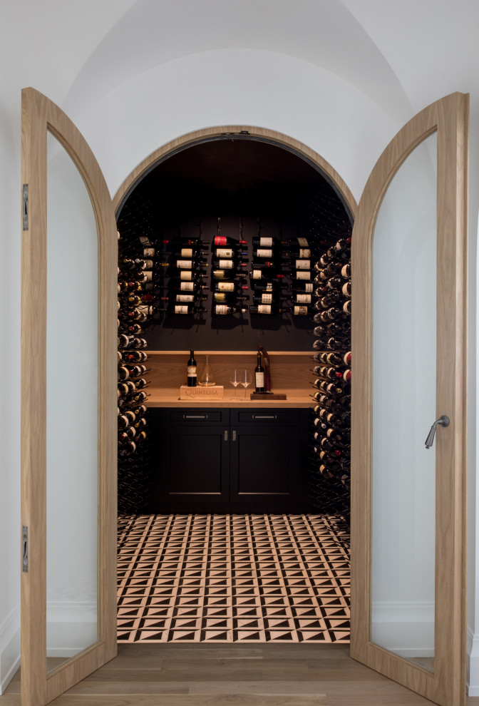 Photo of a transitional wine cellar in New York.