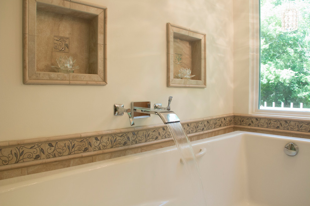 Mid-sized transitional master beige tile and ceramic tile ceramic tile drop-in bathtub photo with an undermount sink, flat-panel cabinets, light wood cabinets, solid surface countertops, a two-piece toilet and beige walls