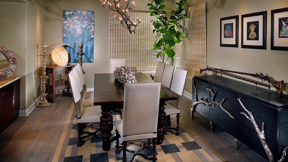 Large transitional medium tone wood floor and brown floor enclosed dining room photo in Orange County with gray walls