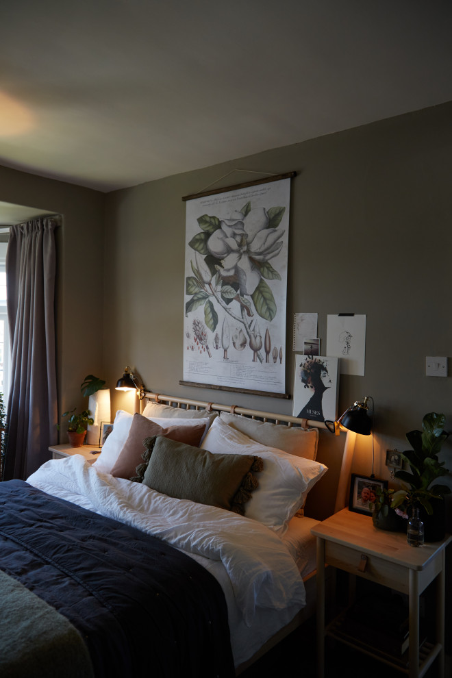 This is an example of a mid-sized eclectic master bedroom in Other with green walls.