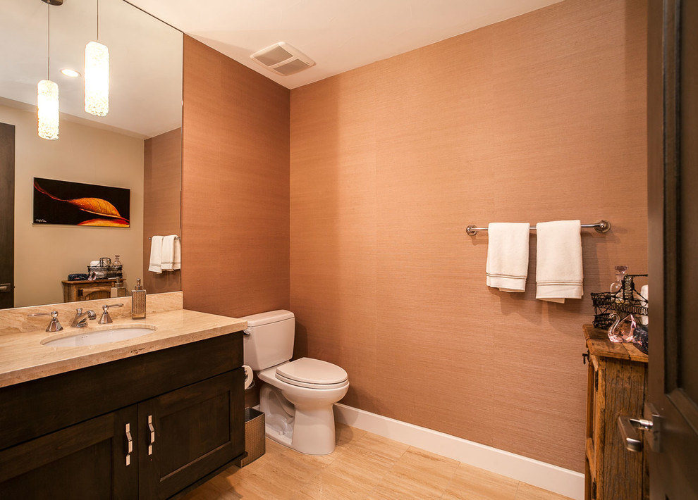 This is an example of a mid-sized transitional master bathroom in Denver with flat-panel cabinets, white cabinets, a one-piece toilet, orange walls, light hardwood floors, an undermount sink and engineered quartz benchtops.