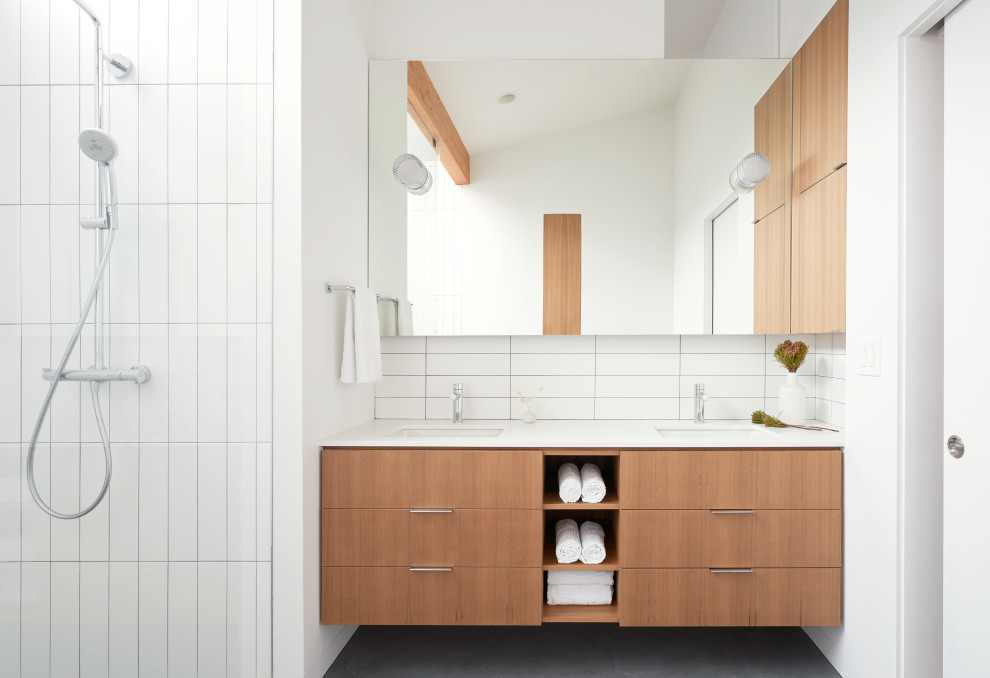 Design ideas for a mid-sized scandinavian master bathroom in Seattle with flat-panel cabinets, medium wood cabinets, an open shower, white tile, ceramic tile, white walls, porcelain floors, an undermount sink, engineered quartz benchtops, grey floor, an open shower and white benchtops.