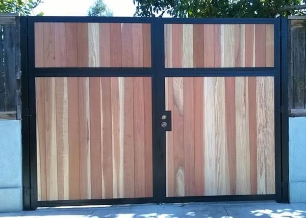 Inspiration for a mid-sized transitional front yard partial sun driveway for summer in Los Angeles with concrete pavers, with a gate and a wood fence.