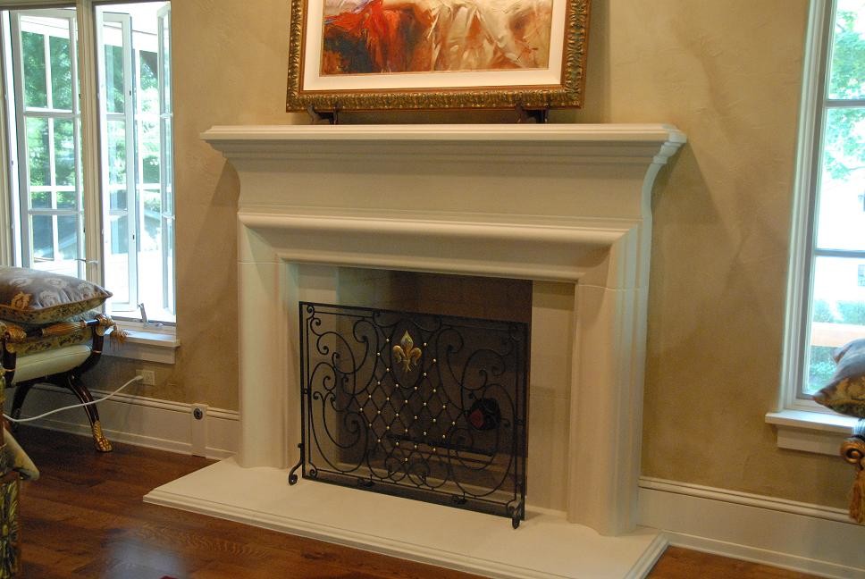 Photo of a traditional living room in Chicago with a standard fireplace and a concrete fireplace surround.