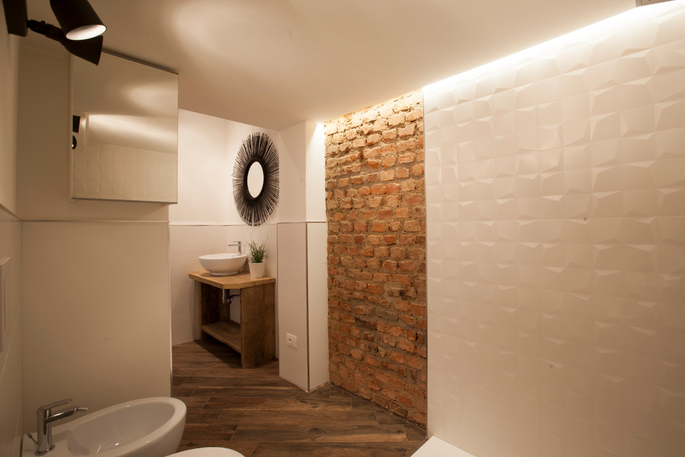 Mid-sized industrial 3/4 bathroom in Milan with light wood cabinets, a two-piece toilet, white tile, ceramic tile, ceramic floors, a vessel sink, wood benchtops and brown floor.