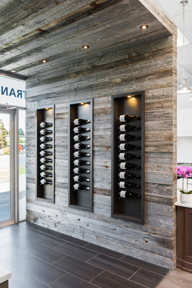 Design ideas for a country wine cellar in Vancouver with display racks.