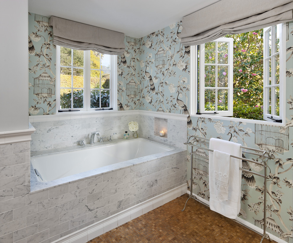 Photo of a traditional bathroom in Santa Barbara with an undermount tub, brown tile, mosaic tile and multi-coloured walls.